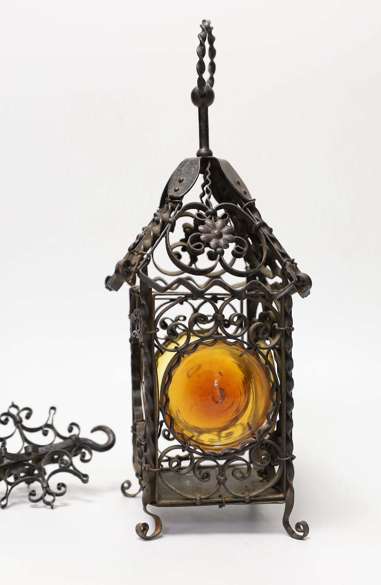 A wrought iron lantern, similar pendant hook, cast miniature brass trunk and bronze effect group, child and dog